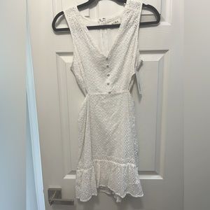 Brand new with tags Aura brand white eyelet dress with side cutouts.